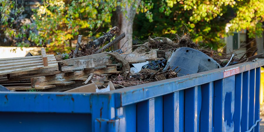 Dumpsters South Florida Bulk removal in Broward County: a Waste Resources crew loading furniture and debris