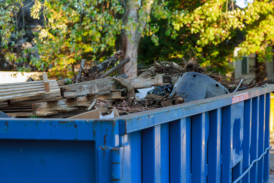 Dumpsters South Florida Bulk removal in Broward County: a Waste Resources crew loading furniture and debris